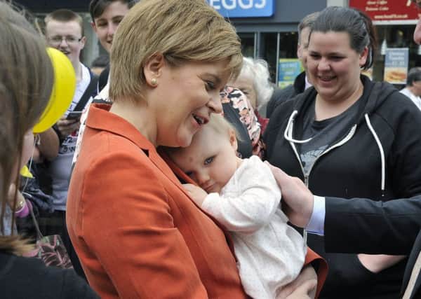 The First Minister gets a cuddle.