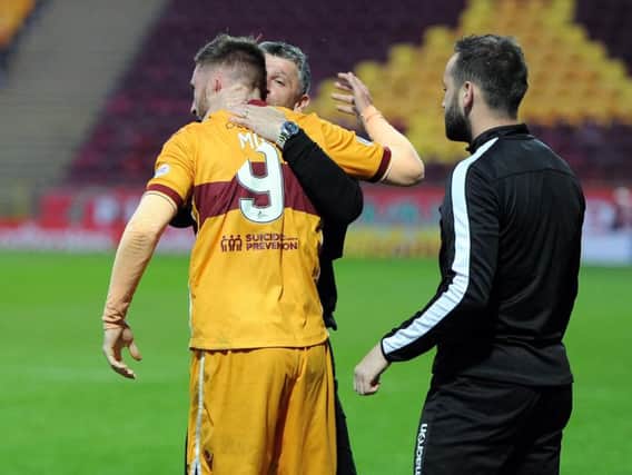 Motherwell manager Stephen Robinson embraces Louis Moult during Tuesday night's 3-1 victory over kilmarnock (Pic by Alan Watson)