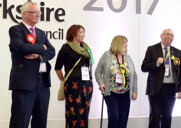 Jim Logue and David Stocks were separated on stage by fellow candidates as they were reelected in Airdrie Central, and now seem further apart than ever