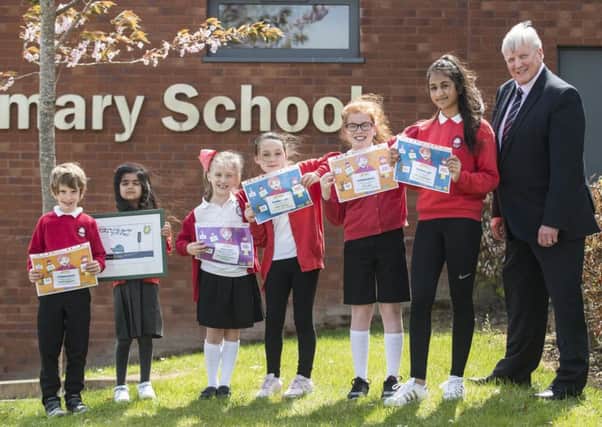 L-R: Pupils Charlie Munogee , Isra Ahmed, Abbie Lowe, Emma Worrall, Erin Lowe and Aneesa Mohammed with Road Safety Scotland director Michael McDonnell.