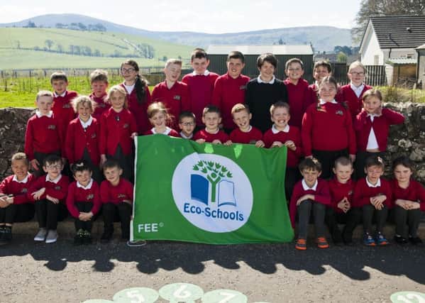 Children from Carmichael Primary celebrate receiving their 2nd Eco Flag     Picture Sarah Peters.