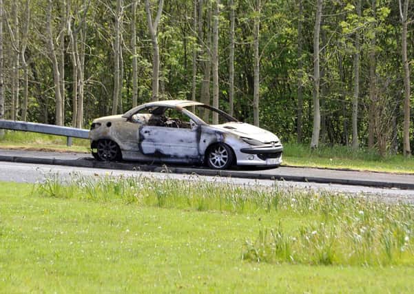 The burnt out car at Allander roundabout.