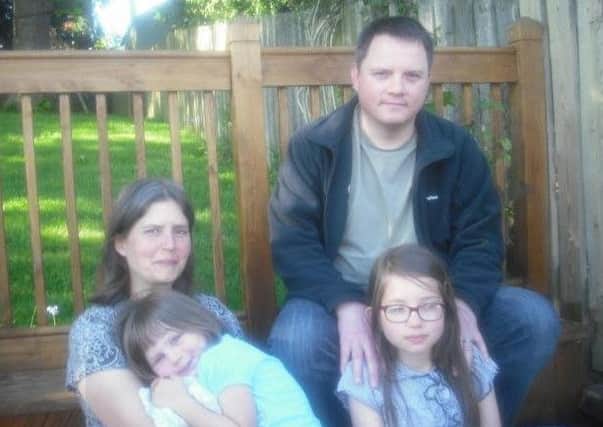 Dr Kevin Parsons with wife Lynne and daughters Skye (3) and Avery (10).