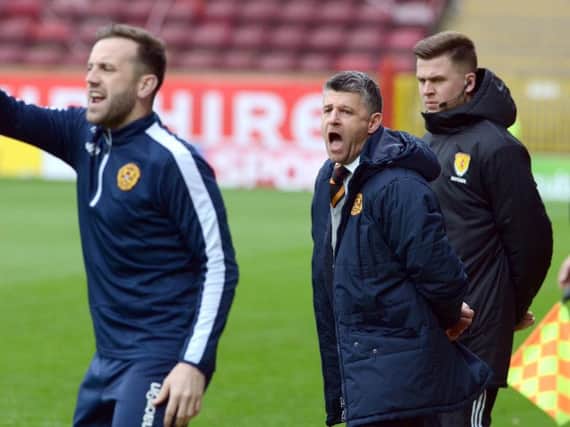Manager Stephen Robinson (centre) says assistant gaffer James McFadden (left) will likely not play for Motherwell next season (Pic by Alan Watson)