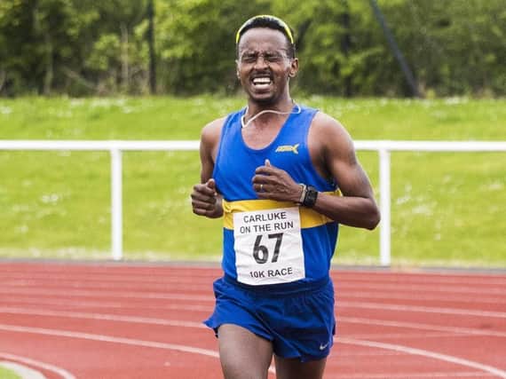 Carluke On The Run 10K winner Tewolde Mengisteab grimaces on his way to a comprehensive victory on Sunday (Pic by Sarah Peters)