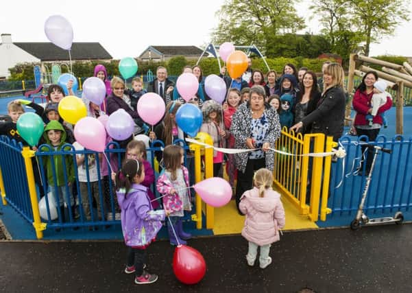 Braehead playpark official opening, with committee member Carol cutting the ribbon. (Picture Sarah Peters)