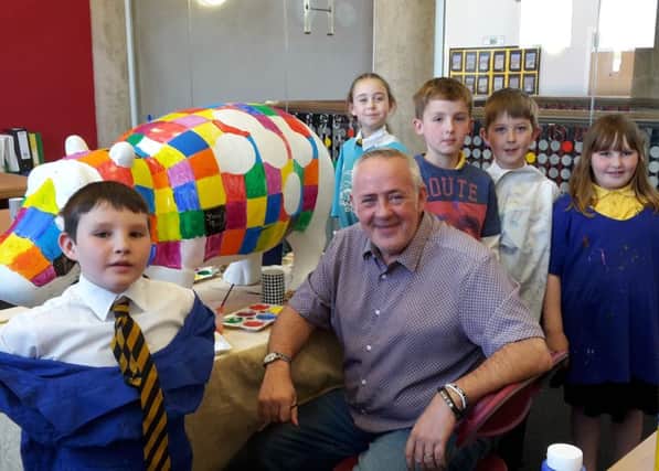 P3 pupil Jacob Boyle who designed Muiredge Primary's hippo for the BIG Stampede and artist Steven Brown, with (back row, l-r) P4 pupils Lucie Findlay, Logan Waugh, Sam Thomas and P5 pupil Elizabeth Boyle