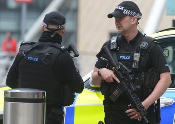 Armed police patrol around Manchester Piccadilly station in the wake of the  Manchester Arena atrocity.