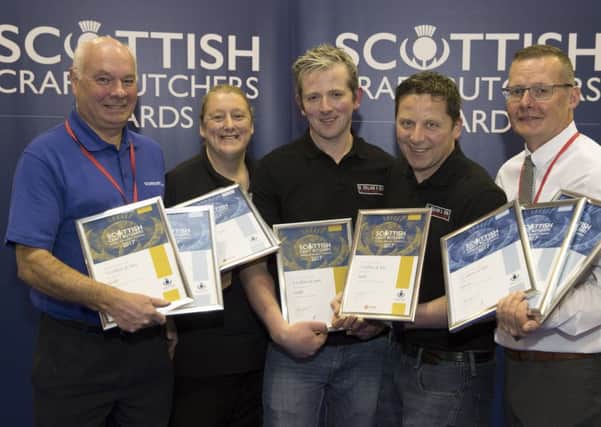 The S Collins & Son team with their impressive collection of awards.