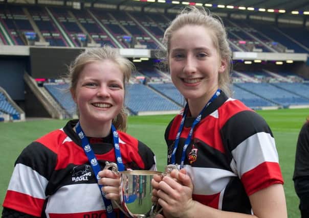 Lenzie's Kirsty Martin (left) and Niamh Proctor after helping Stirling County win the under-18 Scottish cup