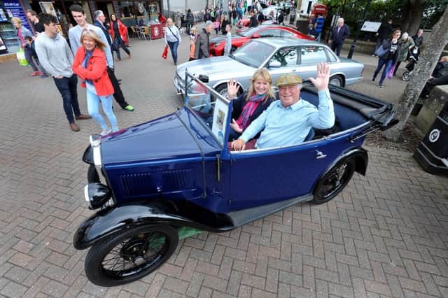 Milngavie personalities Rona Wilson and her pal, ex TV presenter Allan Douglas, at Milngavie Classic Car Show in 2014.