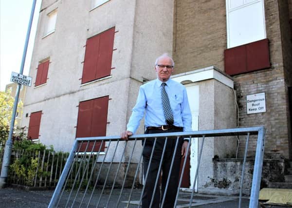 Gil Paterson outside the flats in Nithsdale Crescent, Bearsden.