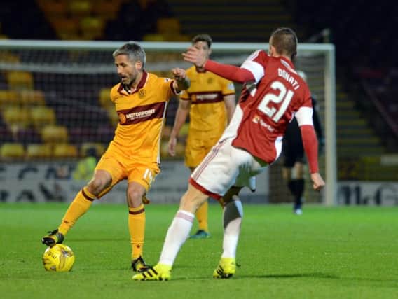 Motherwell ace Keith Lasley has triggered a clause which would see him being retained as a player next season (Pic by Alan Watson)