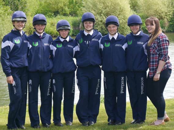 Ruth Haddow (centre) is pictured with her Scotland team-mates from the Royal Windsor Horse Show and their trainer Laura Jack (first right)