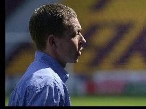 Billy Davies led Motherwell to their first win of the 2000-2001 season with a 3-0 CIS Cup second round win at Queen's Park