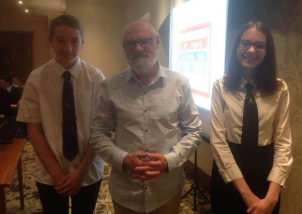 Project Gambia's Frank Devine with Uddingston Grammar pupils Jonathan Smith and Megan Downie