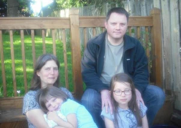 Dr Kevin Parsons with his wife and daughters.