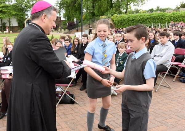 Bishop John Keenan receives the prayers/messages from Our Lady and St Francis Primary