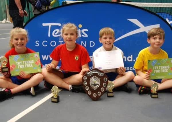 The winning Junior High School tennis team of Freya Easson, Mae Fraser, Jude McEwan and Robbie Livingston.