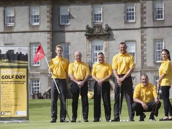 Rab Douglas (third from right) has used many charity golf days to raise money for good causes
