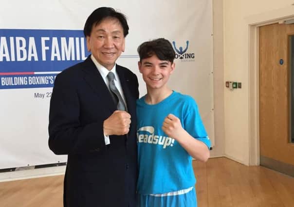 Springburn boxer Gerard McTaggart with Dr. Ching-Kuo Wu, president of the International Boxing Association (AIBA)
