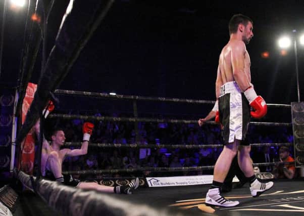 Ogilvie walks away after his bout was stopped for a TKO.