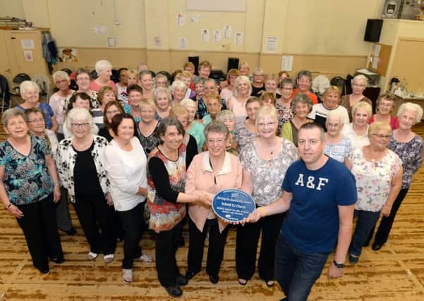 Elaine Gatenby, Jeanette Scott, Joan Steel and Danny Bulloch with the award given to Bellshill EU Congregational Church, joined by members of the line dancing class. Pic: Alan Watson