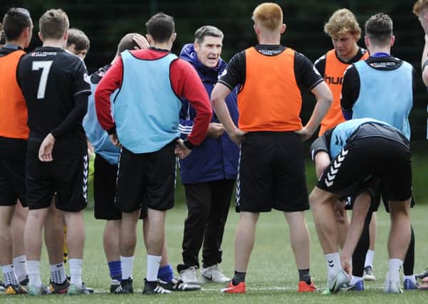 Jim Chapman makes his point during a training session with his new-look Clyde squad