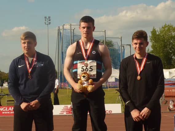 Adam with his record-breaking bronze medal during the under-20 Championships at the Bedforf International Stadium