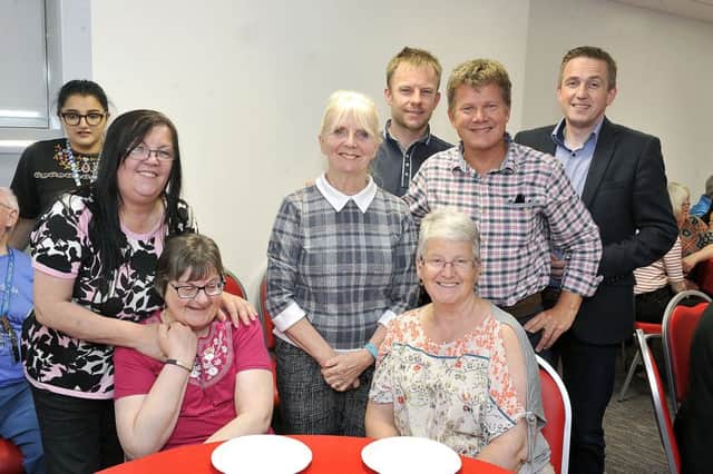 Drena is pictured, centre standing, with some of the many guests at her retiral party and presentation