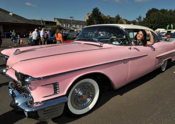 Vintage car rally at Giffnock railway station. Spectacular classic car ll- Kitri du Lac.  The lady driver's  dream was to pose in a pink Cadillac.