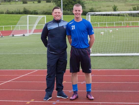 New Carluke FC skipper Gio Smith is pictured with club gaffer Paul Davies
