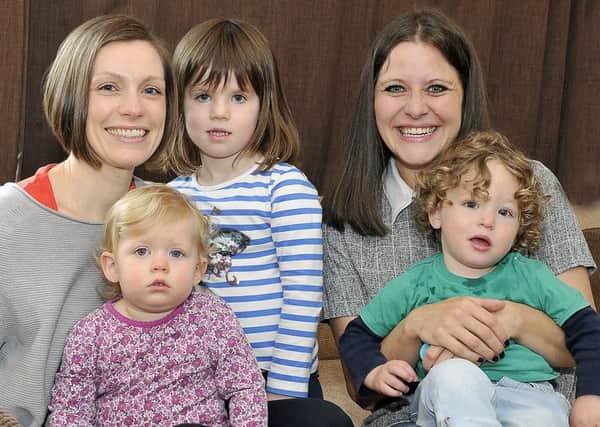 Nicola Sutcliffe and Dr Louise Leven with their young children.
