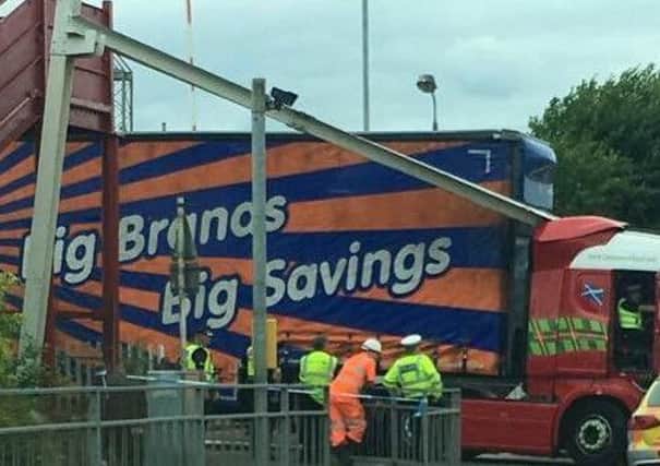 Lorry stuck at level crossing in Motherwell