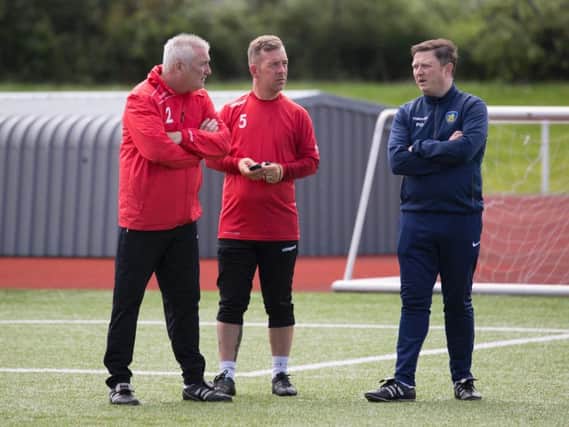 Carluke FC manager Paul Davies (first right) is pictured with (from left) assistant boss Billy McGhie and first team coach David Goodwin (Pic by Siukei Chow of SC Photography