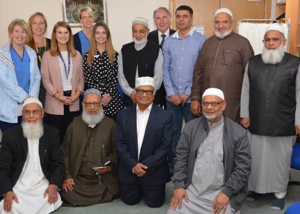 Members of Lanarkshire Central Mosque with representatives of the three charities, Wishaw General Hospitals paediatrics department, the Beatson cancer treatment centre in Airdrie and Kilbryde Hospice in East Kilbride