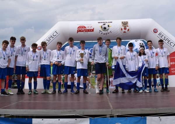 Lenzie 2002s celebrate their victory in the recent Wroclaw Trophy in Poland.