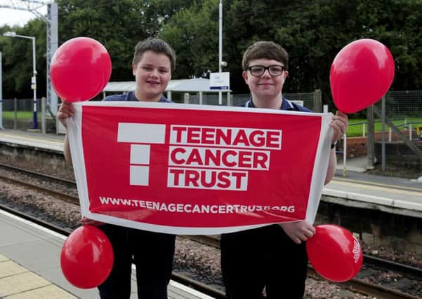 28-07-2017. Picture Michael Gillen. CROY. Croy Railway Station. Adam Niven (13) and Iain Macdonald (14) are travelling to every railway station in SPT region raidsing money on behalf of Teenage Cancer Trust. Adam is from Kirkintilloch and Iain is from Cumbernauld. They are S3 pupils at Lenzie Academy.