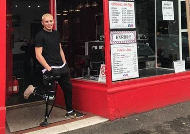 Tony Mann outside his shop with the iwalk2.0