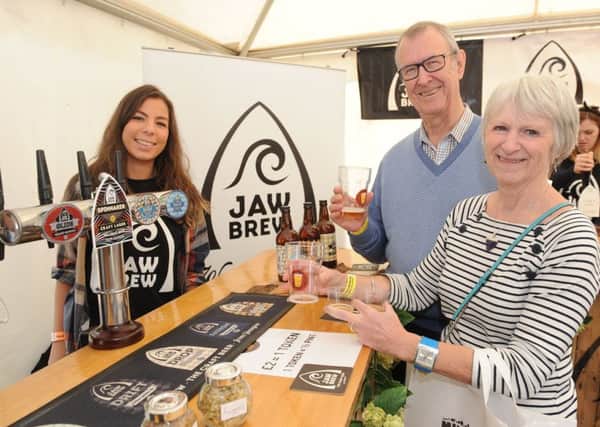 Locals Edna and Bill Newman at last year's Milngavie Beer Festival with Beatciz Gasbar from Jaw Brew.