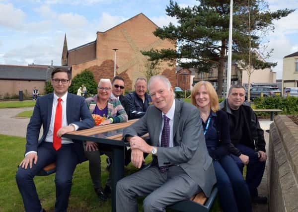 Enjoying the sunshine in the new look area on Windmillhill Street are (l-r) Councillors Kenneth Duffy and Agnes Magowan, Ameys Billy Cullen, Ground Controls Iain Arnott, Councillor Allan Graham, Motherwell Health Centres Jeanette Clarkson and Ameys  David Swan.