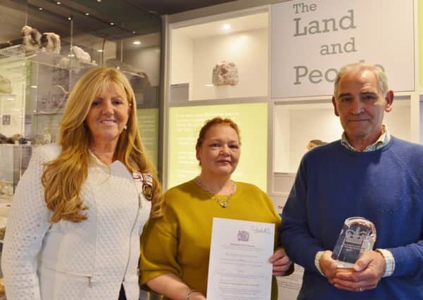 Biggar Museum receives Queen's Award for Volunteers

 (from left to right) Lady Haughey, and June Irwin and Blane Duncan receiving the Award on behalf of all the museum volunteers.