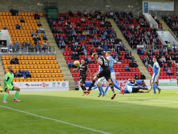 Alex Fisher heads home Motherwell's first half goal at St Johnstone (Pic by Ian McFadyen)