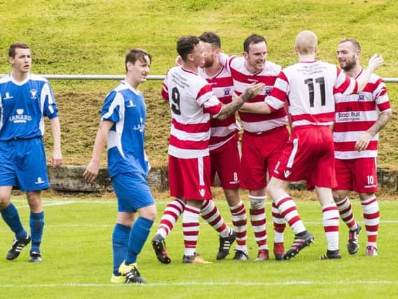 Lesmahagow players celebrate Steven Clarks goal in the draw against Lanark United on Saturday (Pic by Sarah Peters)