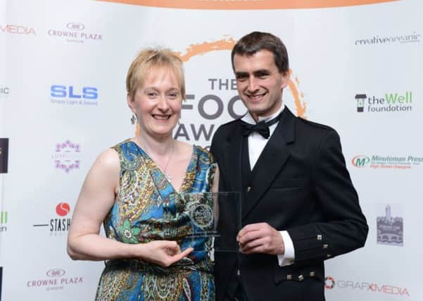 Jane and Ranald Brown with their award.