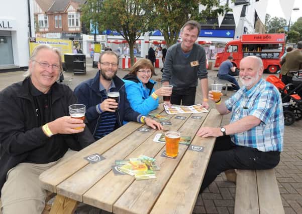 Locals enjoying themselves at last year's Milngavie Beer Festival with volunteer Councillor Jim Gibbons.