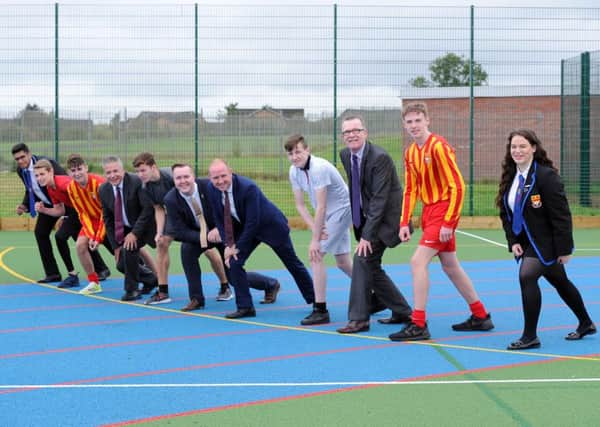 On their marks at the new games area are Cardinal Newman pupils with head teacher Kenny Ross and councillors Jordan Linden, Frank McNally and Harry Curran
