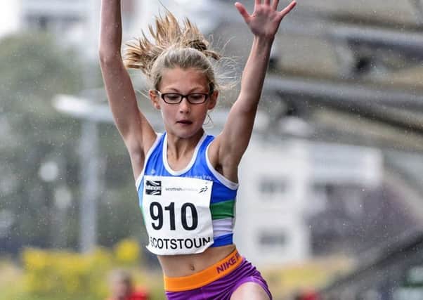 Holly Kirkwood leaps to long jump gold (pic by Bobby Gavin).