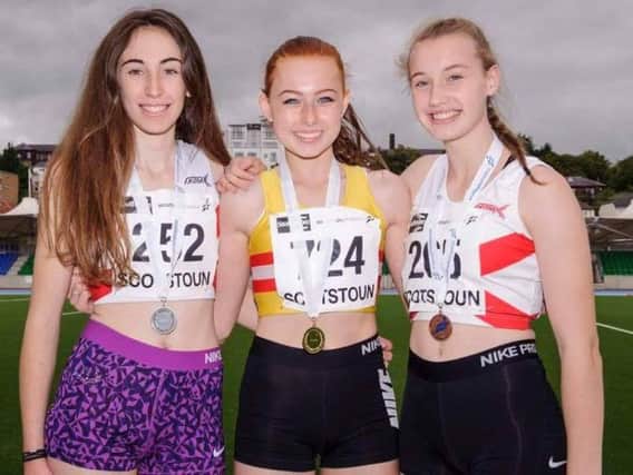 Katie Foss (centre) with fellow medallists