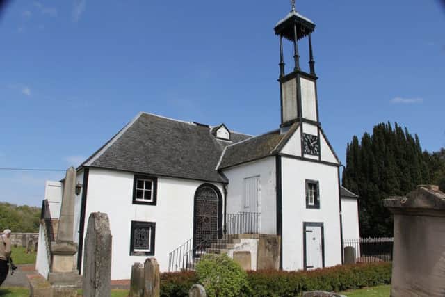 An old view of Dalserf with its landmark kirk in the background